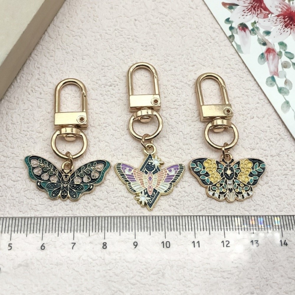 素敵なカラフルな蝶のキーホルダー エナメルクラフト合金の蛾の - Butterfly Rubber Sheet のレビューと価格