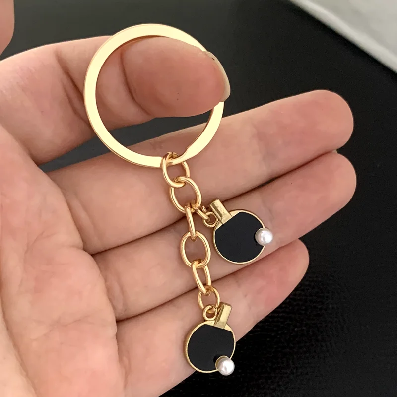 黒赤スポーツ卓球テニスキーチェーンクリエイティブ卓球バットキ - Table Tennis Keychain のレビューと価格