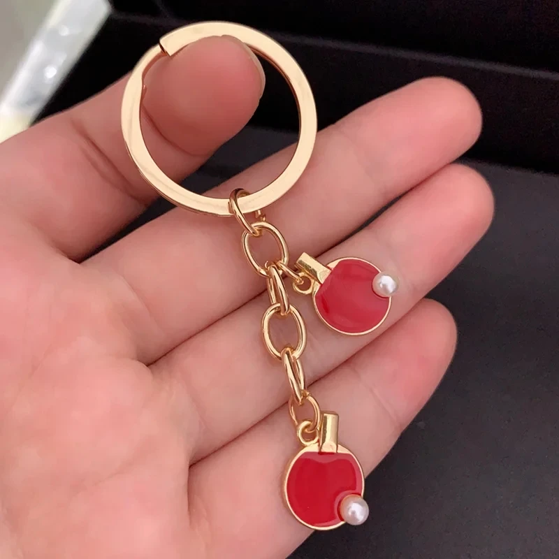 黒赤スポーツ卓球テニスキーチェーンクリエイティブ卓球バットキ - Table Tennis Keychain のレビューと価格